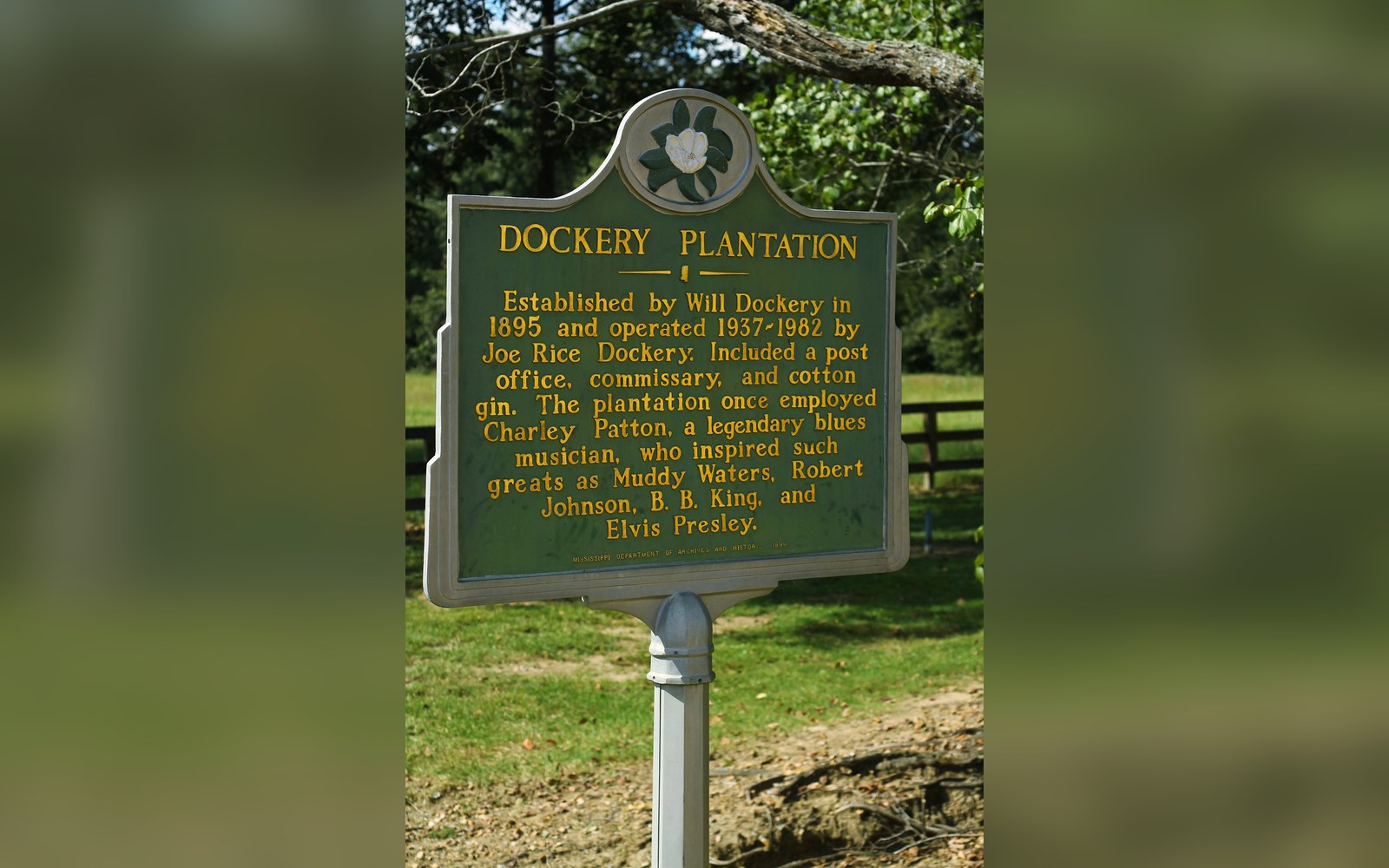 Historical marker for Dockery Plantation describing its founding and blues musician Charley Patton